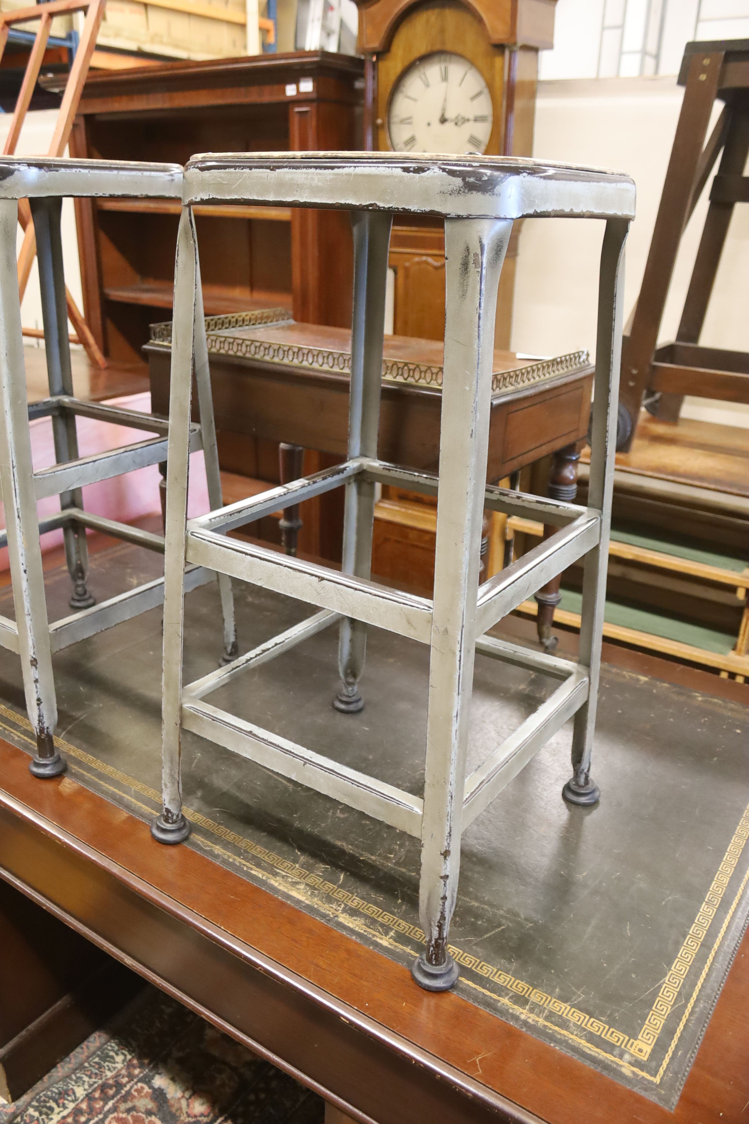 A pair of industrial style steel stools, height 74cm